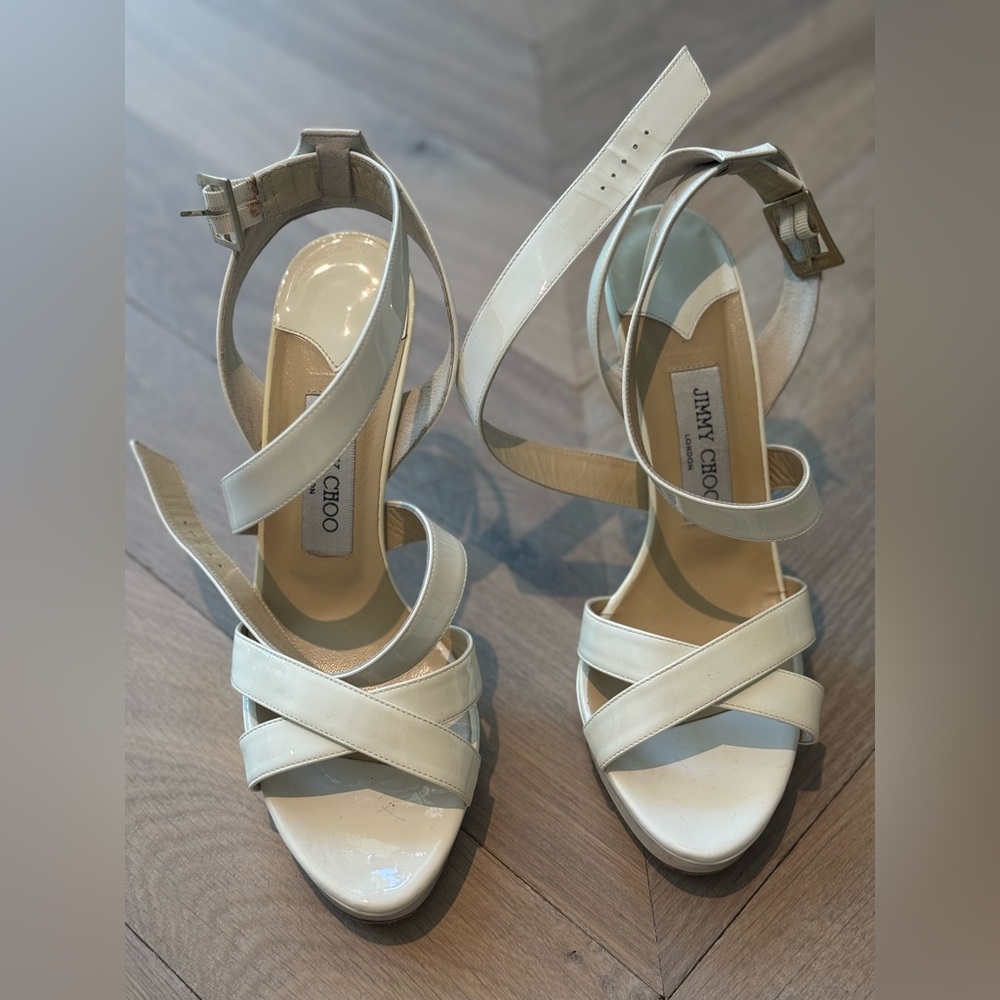 White Jimmy Choo heels.